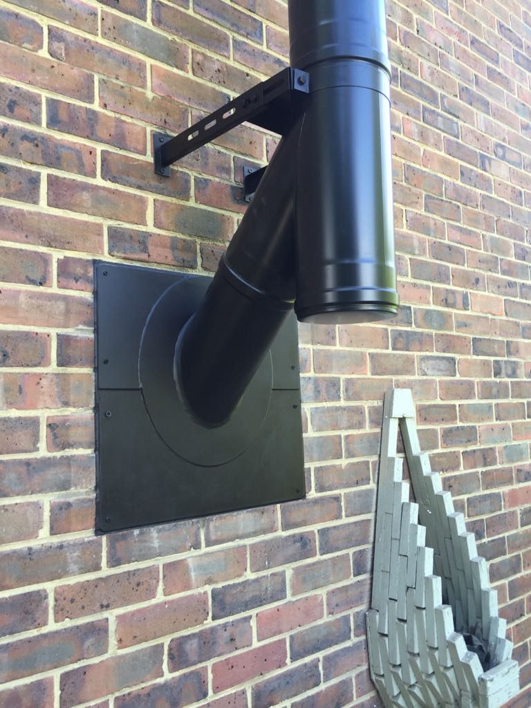 The flue on the outside wall